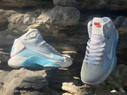 Front and side presentation showing the high-top shape, white laces, and light blue side panels.