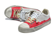 Pair of red and gray sneakers with contrasting laces