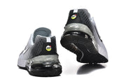 Rear and outsole views of white and black Nike Air Max sneakers.