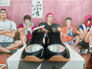 Front view showing the black laces, patterned toe panels, and gum-colored outsole of the sneakers.