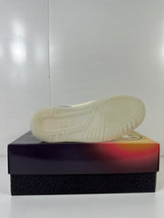 Underside view showing the light-colored outsole and circular traction pattern.
