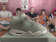 Side profile of a gray high-top sneaker with layered overlays, mesh-style paneling, and a light outsole.