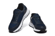Navy sneakers shown from front and three-quarter angles.