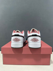 Rear view of a pair of pink and white sneakers showing branded heel panels and black heel overlays.