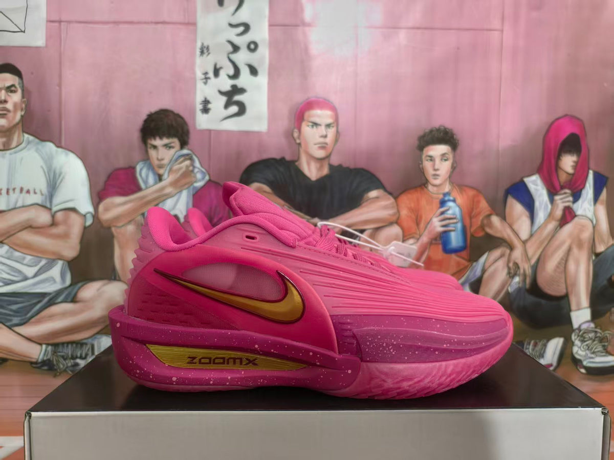 Side view of a pink Nike basketball shoe with a metallic gold Swoosh and speckled midsole.