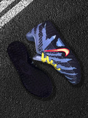 Blue Nike sneaker with yellow laces and dark outsole shown beside a matching outsole piece.