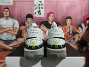 Rear view showing black heel panels, neon green embroidered details, and translucent outsole sections.
