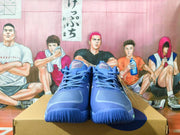 Front view of the blue lace-up ASICS basketball shoes.
