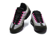 Front view of a pair of Nike Air Max 95 TT sneakers with black laces and pink details.