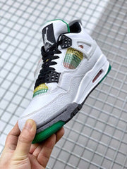 Angled side view of the white sneaker with black tongue and laces, multicolor mesh, and green outsole.