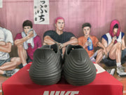 Rear view of smoke gray Nike sneakers showing layered heel detailing on a red Nike box.