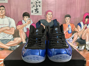 Front view showing black laces, blue toe panels, and light-colored outsoles