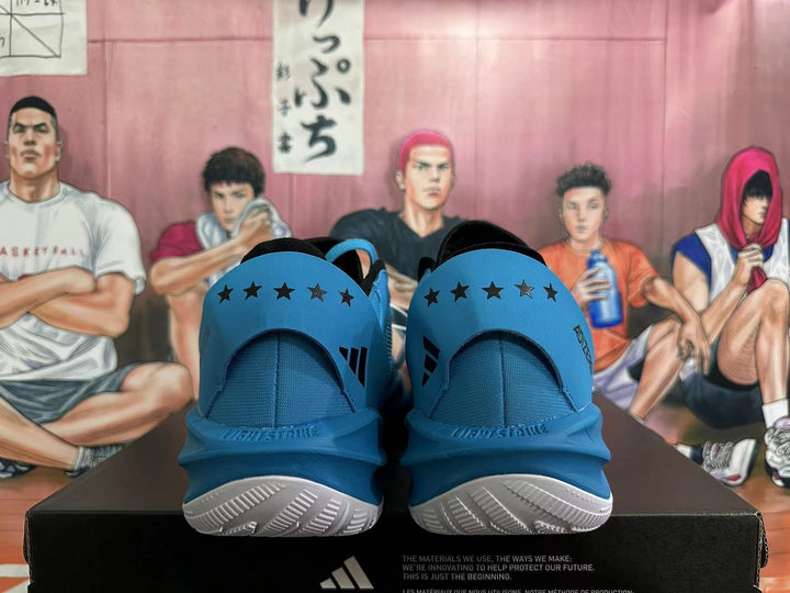 Rear view of blue Adidas Adizero basketball shoes with black star details and white outsoles