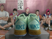 Rear view of the pair showing Nike branding, blue heel accents, and gold-toned heel sections.