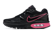 Side profile of a black and pink Nike Air Max BW sneaker
