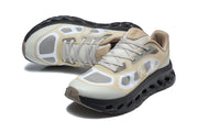 On Cloudtilt Remix sneakers viewed from above and at an angle, showing the lace-up front and gray panel details.