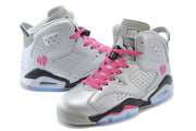 Pair of silver-gray high-top sneakers shown from opposing angles with bright pink laces and translucent blue outsole sections.