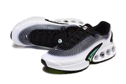 Angled top and side view of black, white, and green Nike Air Max sneakers.