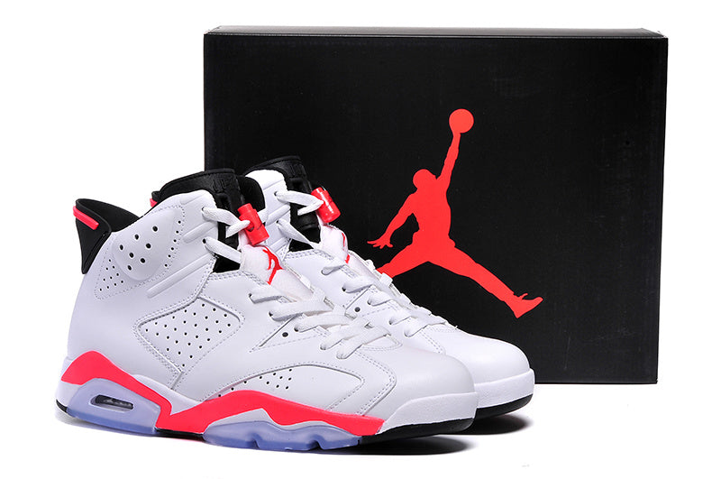 Pair of white, black, and bright red Air Jordan 6 high-top sneakers displayed beside a black Jordan shoebox.