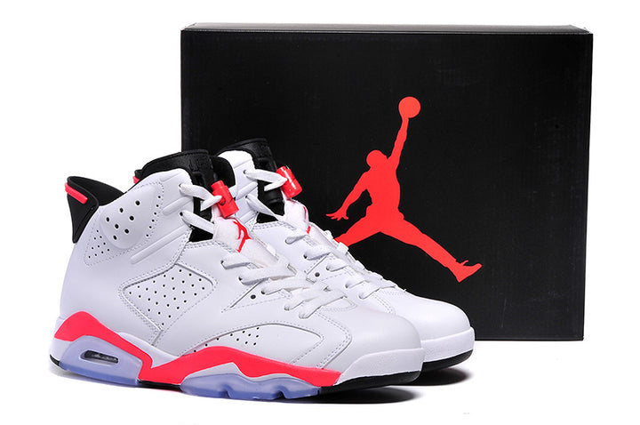 Pair of white, black, and bright red Air Jordan 6 high-top sneakers displayed beside a black Jordan shoebox.