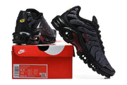 Nike Air Max Plus sneakers displayed with a box label showing size information and style code.