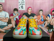 Front view of multicolor basketball sneakers showing yellow laces, gray tongues, and colorful uppers.