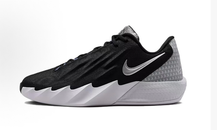 Black Nike sneaker with a gray patterned heel panel, metallic-look side Swoosh, and white sculpted sole