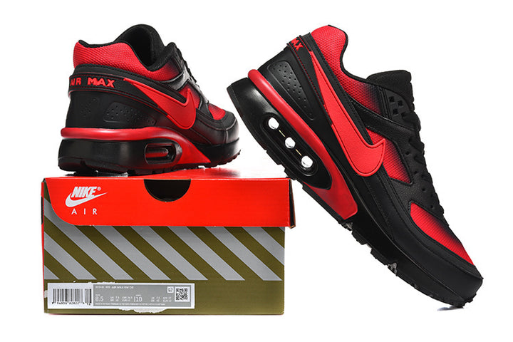 Black and red Nike Air Max sneakers displayed on a Nike Air shoe box; the box label shows a sample size of 8.5.