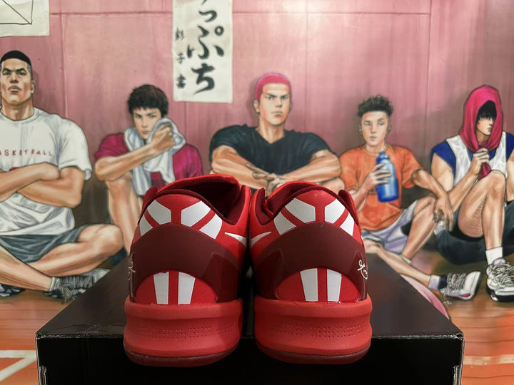 Rear view of red heart-pattern Nike Kobe basketball shoes with contrasting heel details.