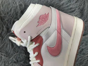 Close-up of the pink side panel, Swoosh detail, ankle branding, and white laces.