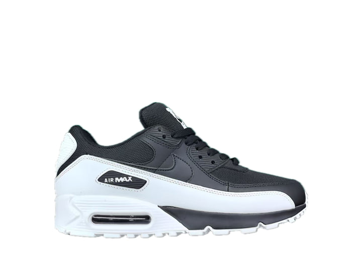 Side view of a black and white Nike Air Max low-top sneaker with a visible heel window.