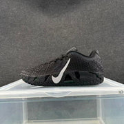 Side view of a black basketball sneaker showing the silver Swoosh, textured upper and patterned outsole.
