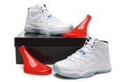 White high-top Jordan sneakers displayed with a black box and red shoe-shaped props.