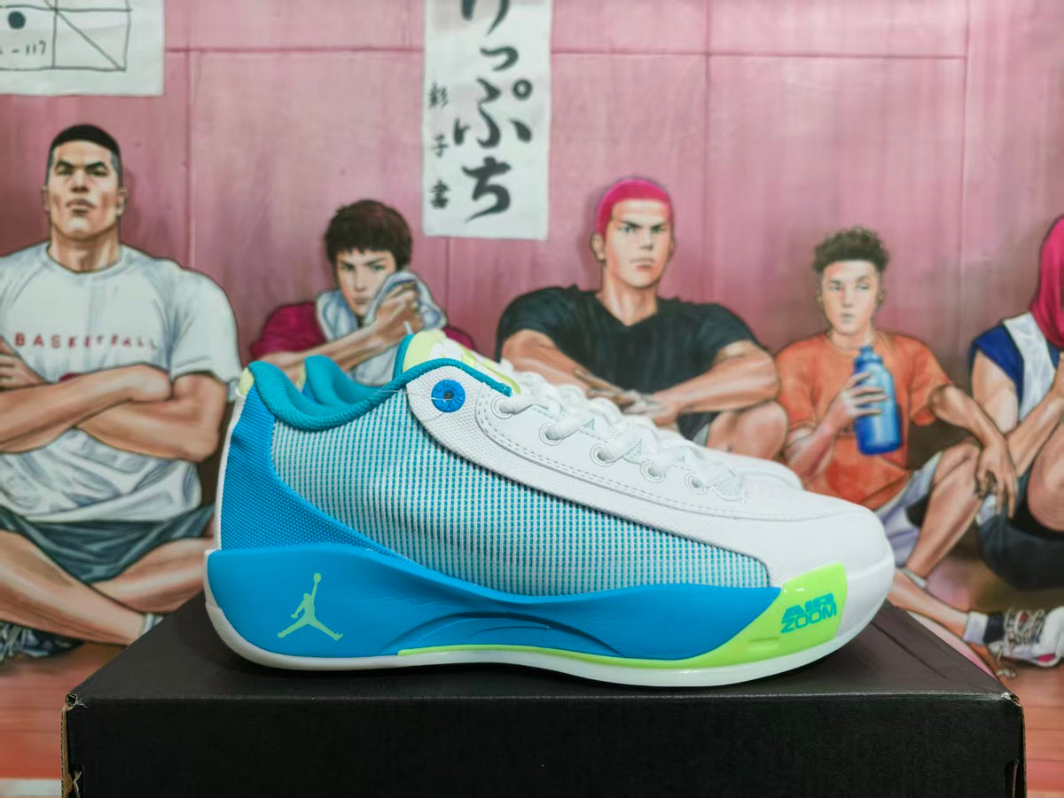Side view of a gray-blue Jordan basketball sneaker with a white upper, blue midsole accents, lime details, and visible Air Zoom text.