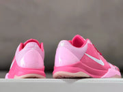 Rear view showing the pink heel details and side Swoosh