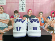 Rear view showing the white heel panels, purple accents, and translucent outsole.