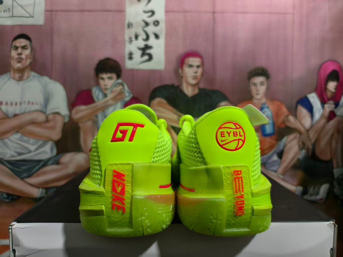Heel view of volt-green Nike basketball shoes with red details and EYBL branding.