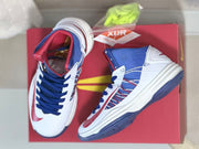 Top and side views of the shoes displayed on a red box