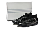 Pair of black sneakers shown with a plain box