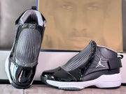 Front and side views highlighting the gray woven-look panels and glossy black toes