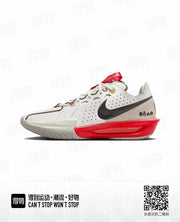 White Nike basketball sneaker with a black Swoosh, bright red sculpted midsole section, and red tongue detail.