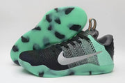 Nike Kobe 11 All-Star shoes showing the black and mint upper and patterned outsole