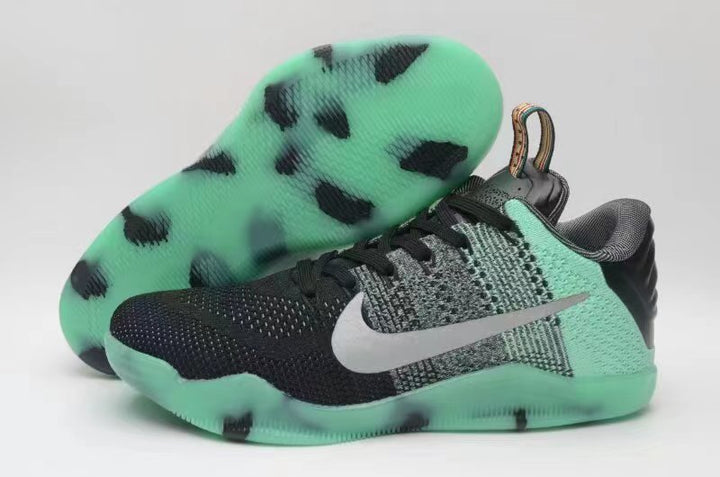 Nike Kobe 11 All-Star shoes showing the black and mint upper and patterned outsole