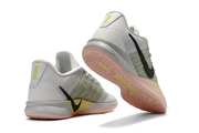 White and mint Nike Sabrina 3 shoes shown from the heel and outsole
