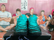 Front view of the green and black Nike sneakers showing the padded tongues, laces, and textured toe areas.