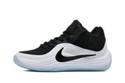 Side profile of a black and white Nike sneaker with a black Swoosh and textured layered midsole design.