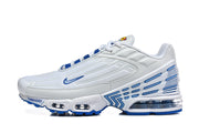 Side view of a white Nike Air Max Plus III sneaker with blue accents, visible cushioning units and a sculpted heel.