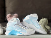 Angled view of the white and pale blue Nike HD2008 kids high-top sneakers.