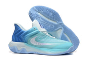 Side and outsole view of the aqua-blue Nike shoes