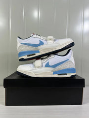 Side view of the pair showing the blue Swoosh, patterned heel overlay, forefoot strap and visible midsole air window.
